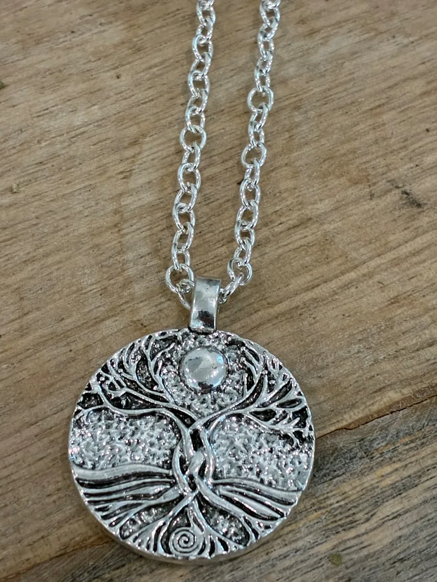 Tree of Tides Medallion — silver tree of life medallion with a clear stone